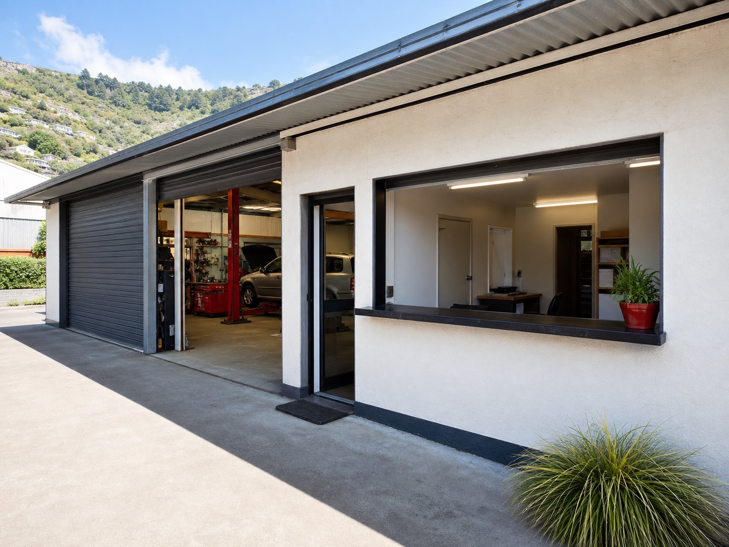 Generated placeholder image of a modest automotive workshop entrance and reception area.
